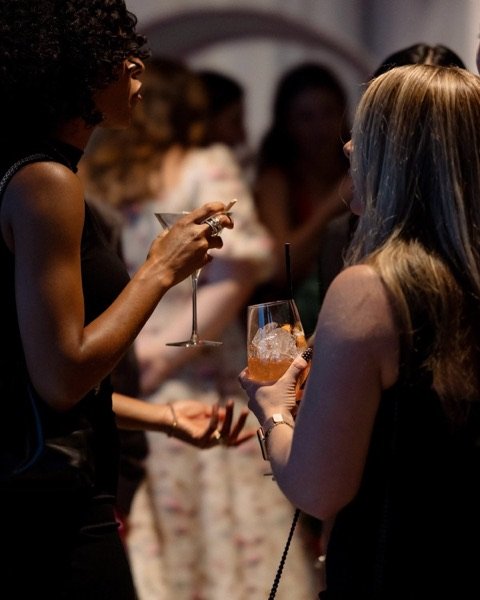 Guests with drinks at an evening reception