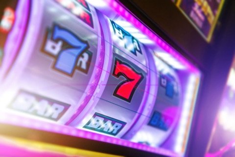 Slot machine reels lined up on sevens